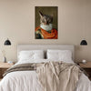 Bedroom with cat portrait above bed